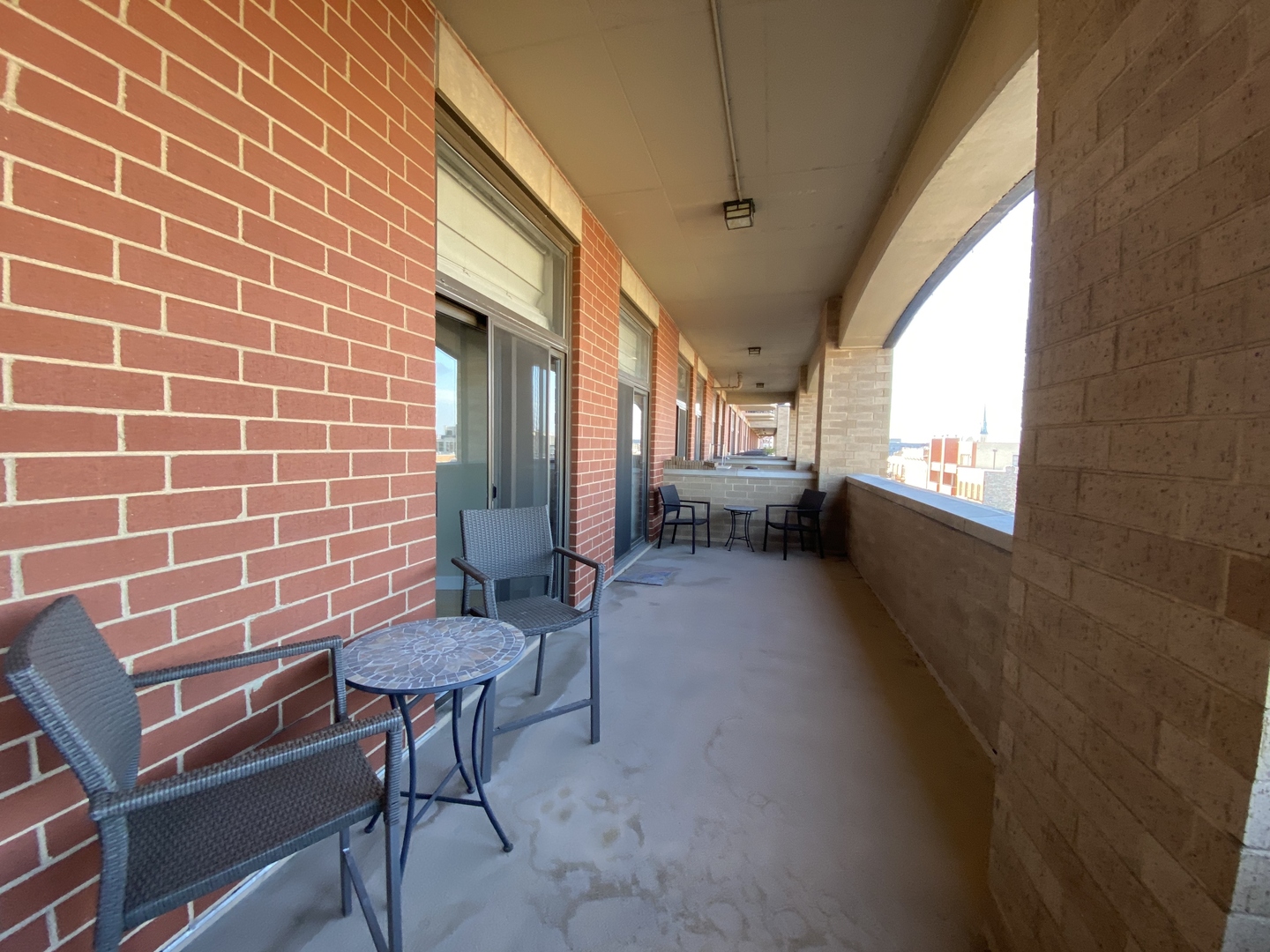 1301 West Madison Street, Unit 506 Chicago, IL 60607 - Photo 22 of 23 a balcony with chairs and a table