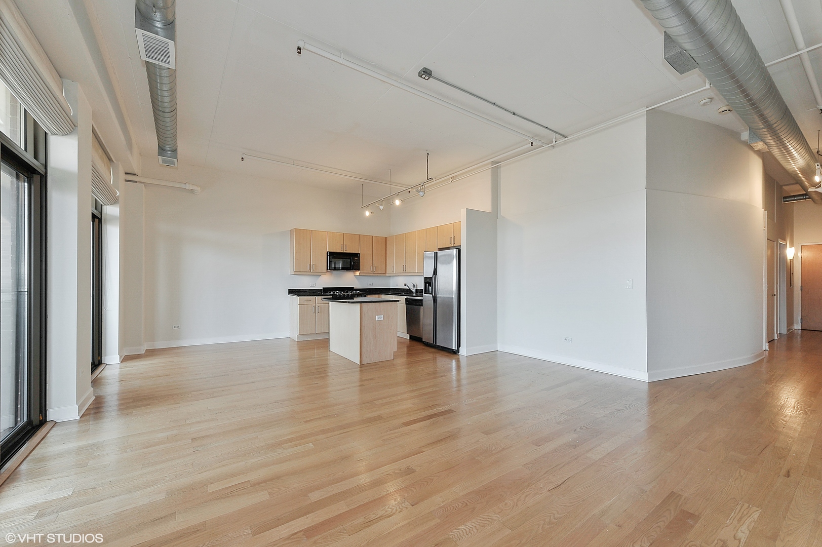 1301 West Madison Street, Unit 506 Chicago, IL 60607 - Photo 3 of 23 a view of kitchen with stainless steel appliances kitchen island in the center
