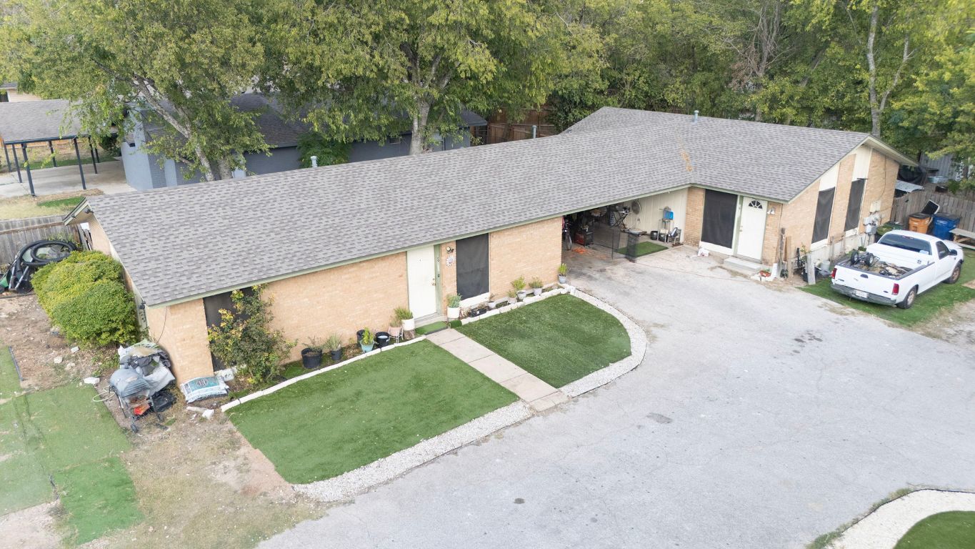 6911 Cooper Lane Austin, TX 78745 - Photo 2 of 16 aerial view of a house with a yard
