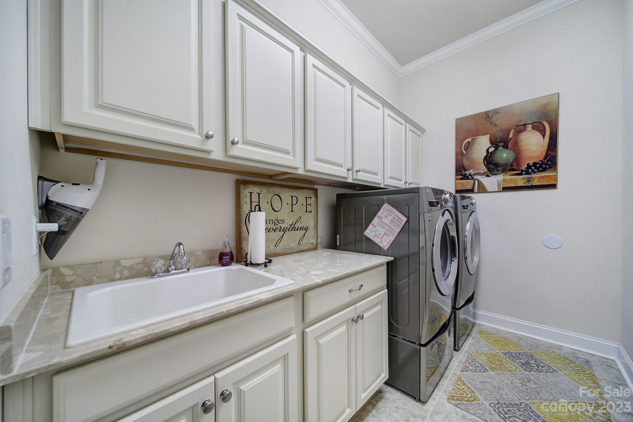 1356 Afton Way Fort Mill, SC 29708 - Photo 8 of 46 a utility room with stainless steel appliances granite countertop a sink and a washer dryer
