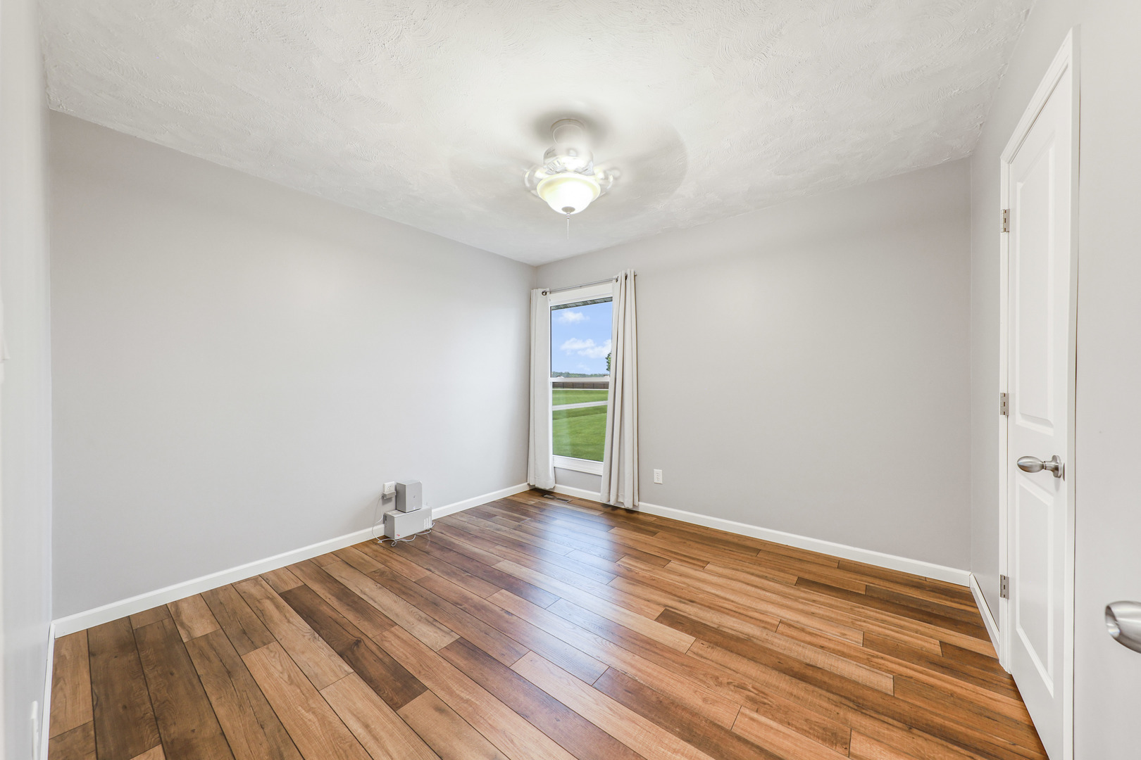 2433 East 2850th Road Marseilles, IL 61341 - Photo 8 of 20 a view of empty room with wooden floor