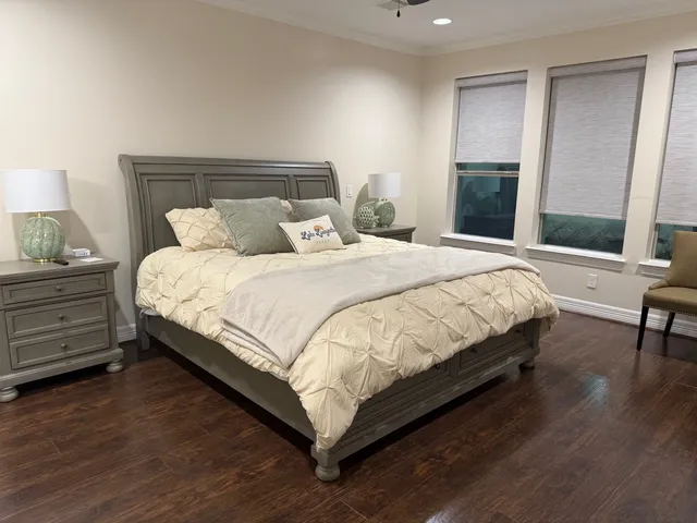 a bedroom with a bed and a mirror