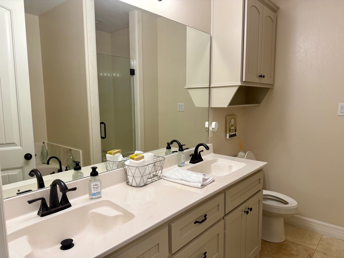 2112 Fm 3186, Unit B8 Onalaska, TX 77360 - Photo 12 of 25 a bathroom with a sink and a mirror