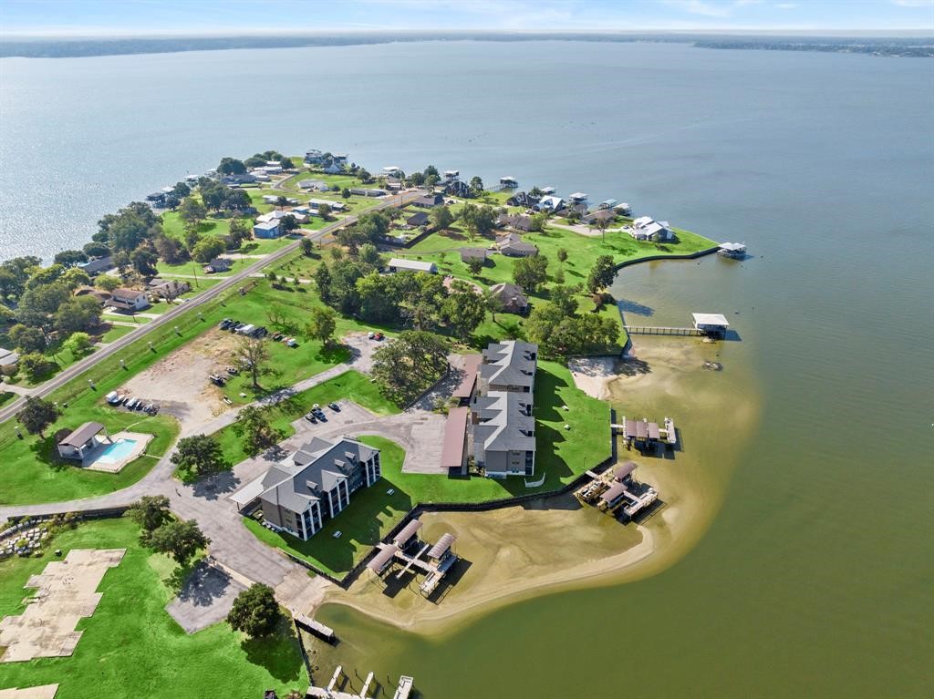 2112 Fm 3186, Unit B8 Onalaska, TX 77360 - Photo 25 of 25 an aerial view of a house with a yard and lake view