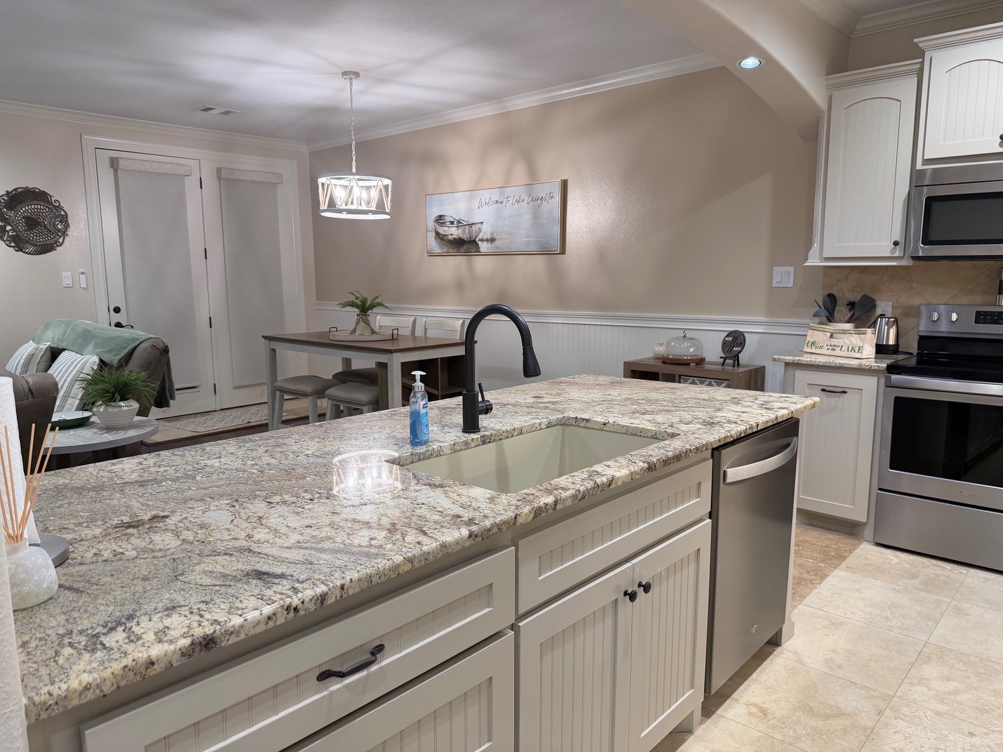 2112 Fm 3186, Unit B8 Onalaska, TX 77360 - Photo 8 of 25 a kitchen with granite countertop a sink and a stove top oven