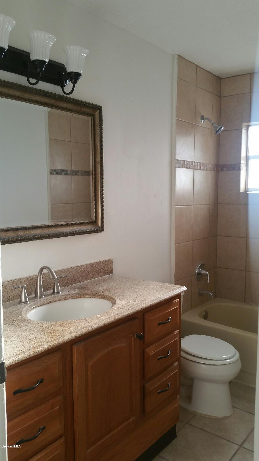 623 Tooley Road Southwest Palm Bay, FL 32908 - Photo 3 of 6 updated bathroom