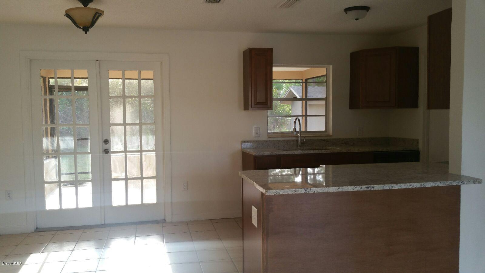 623 Tooley Road Southwest Palm Bay, FL 32908 - Photo 5 of 6 kitchen LR view
