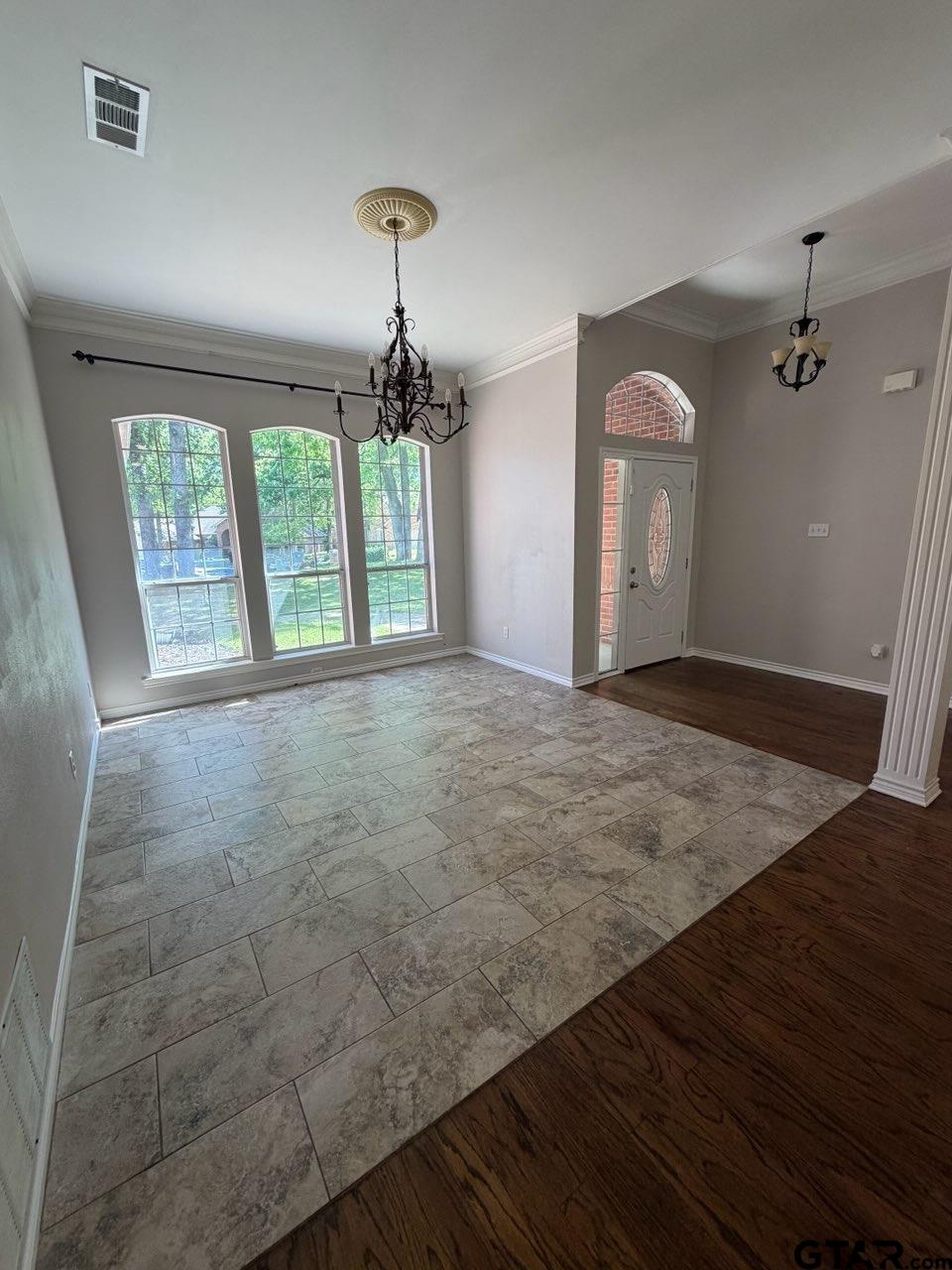 3204 Pebblebrook Circle Tyler, TX 75707 - Photo 5 of 18 wooden floor in an empty room with a window