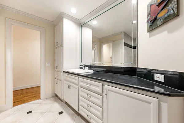 a bathroom with a sink and a mirror