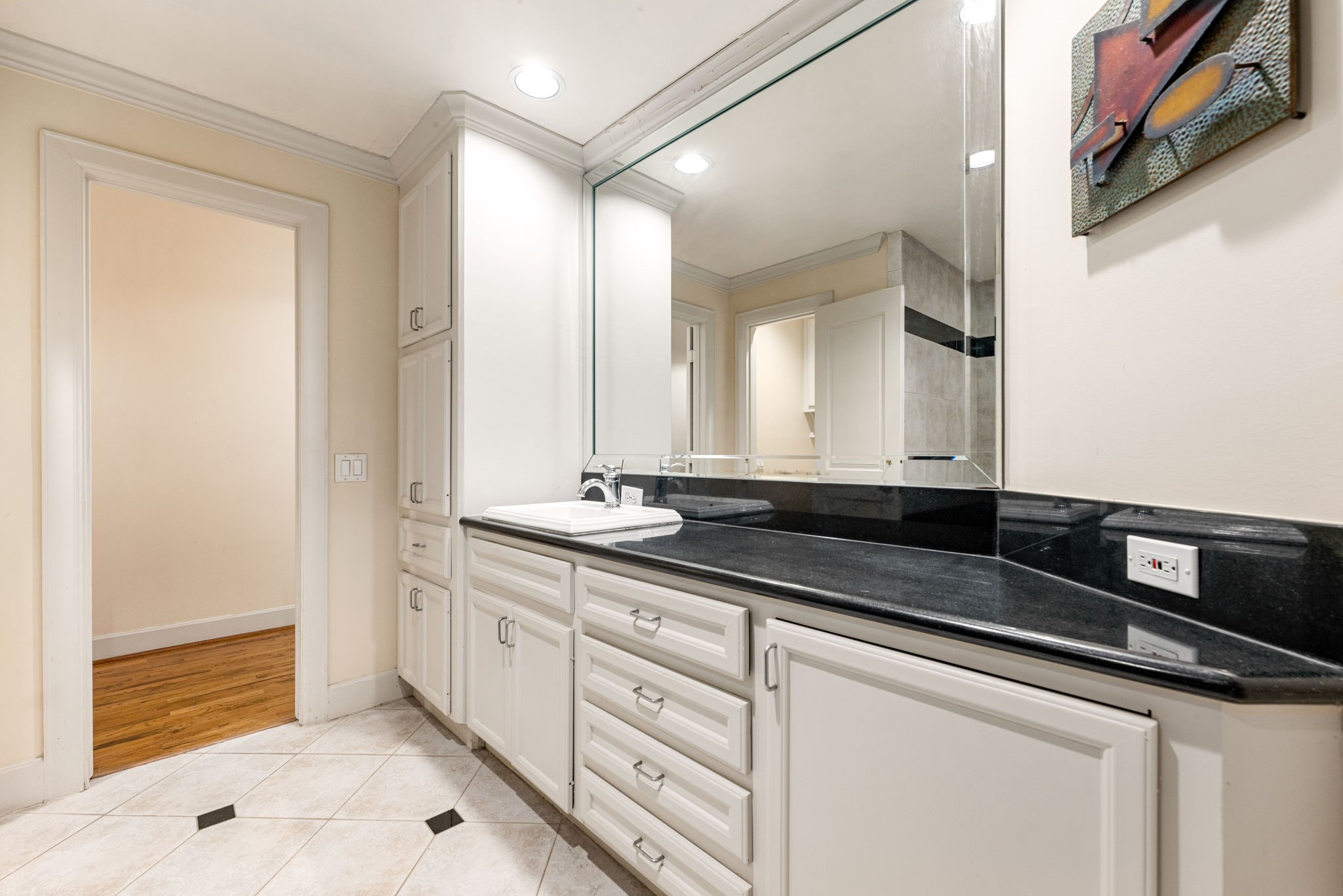 1120 Texas Street, Unit 7D Houston, TX 77002 - Photo 21 of 28 a bathroom with a sink and a mirror