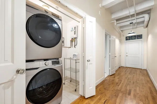 a view of a hallway with washer and dryer