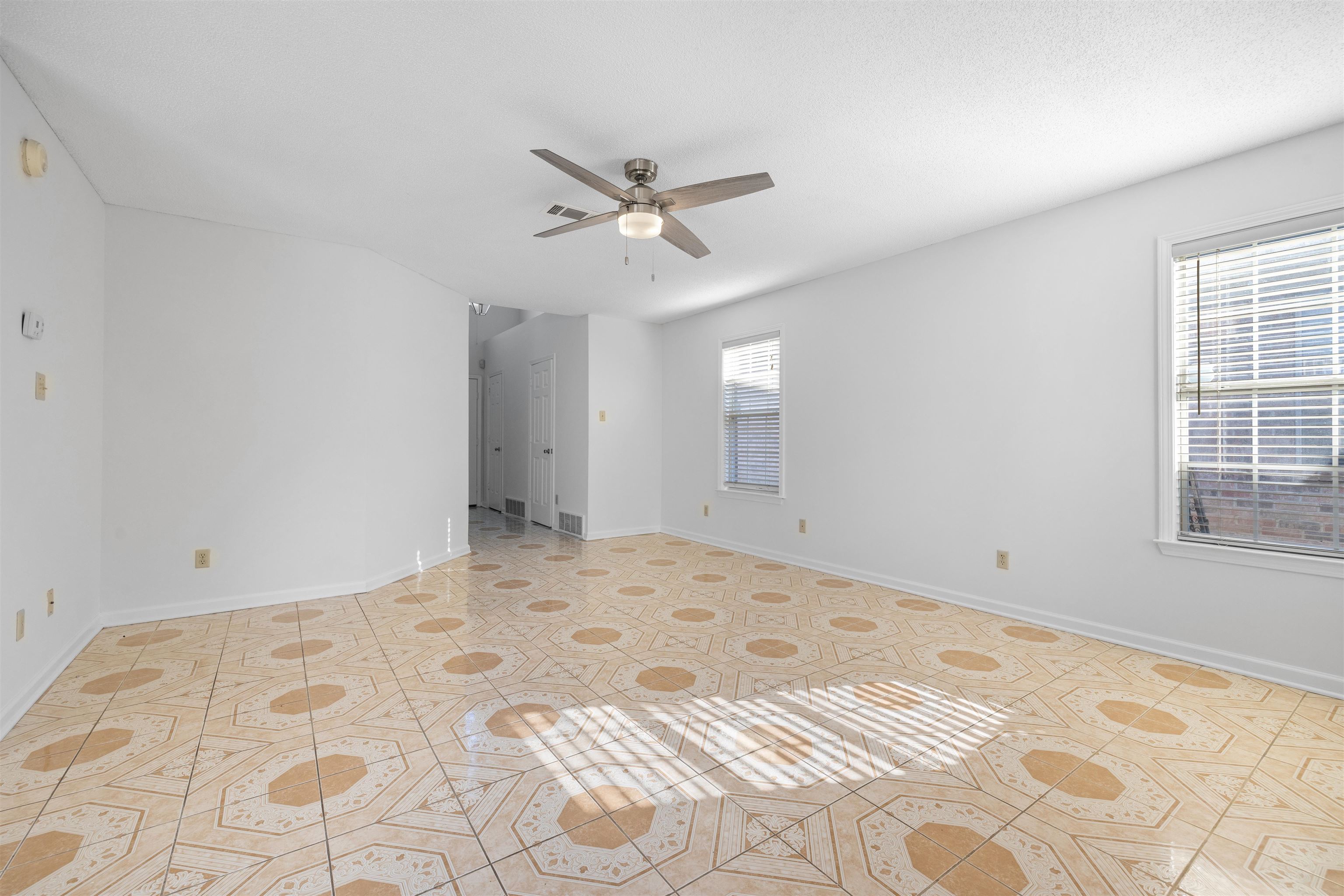 7361 Appling Ridge Drive Cordova, TN 38018 - Photo 12 of 31 Unfurnished room featuring a ceiling fan and light tile patterned floors