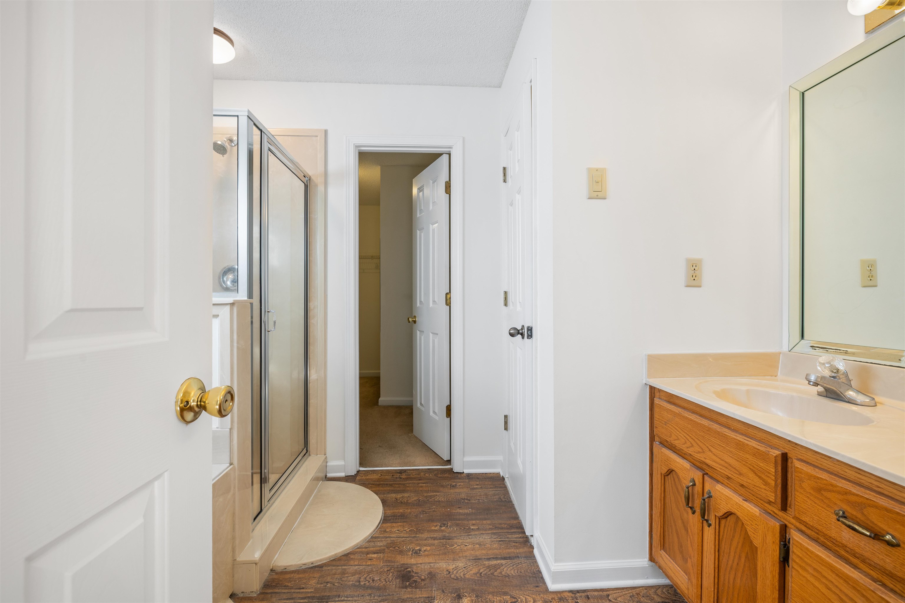 7361 Appling Ridge Drive Cordova, TN 38018 - Photo 22 of 31 Full bath featuring vanity, a stall shower, and dark wood-type flooring