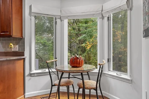 a dining room with furniture and windows