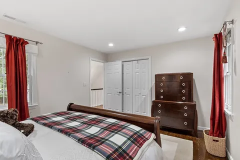 a bedroom with a bed and a closet