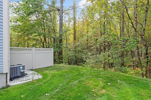 a view of a backyard with pathway