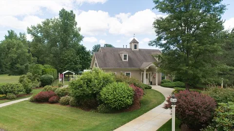 a view of a swimming pool with a patio and a garden