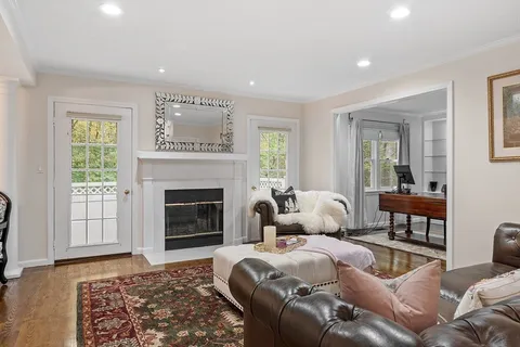 a bedroom with a large bed and a fireplace