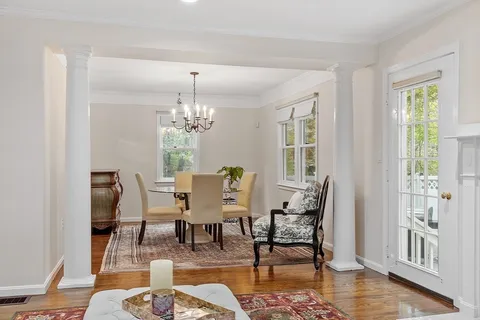 a view of a dining room with furniture window and wooden floor