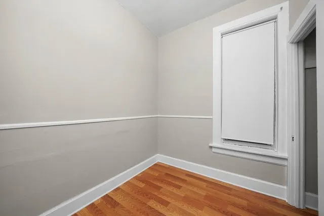 a view of a small space with wooden floor
