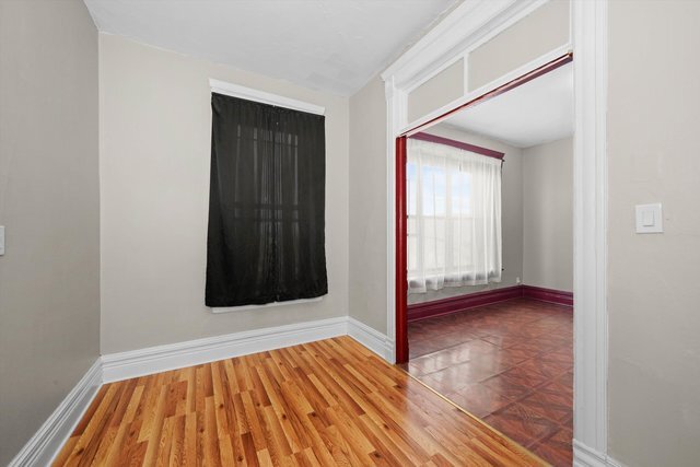 2140 West Cermak Road, Unit 3 Chicago, IL 60608 - Photo 5 of 15 a view of an empty room with wooden floor