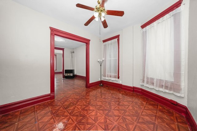 2140 West Cermak Road, Unit 3 Chicago, IL 60608 - Photo 9 of 15 a view of a room with a ceiling fan and window