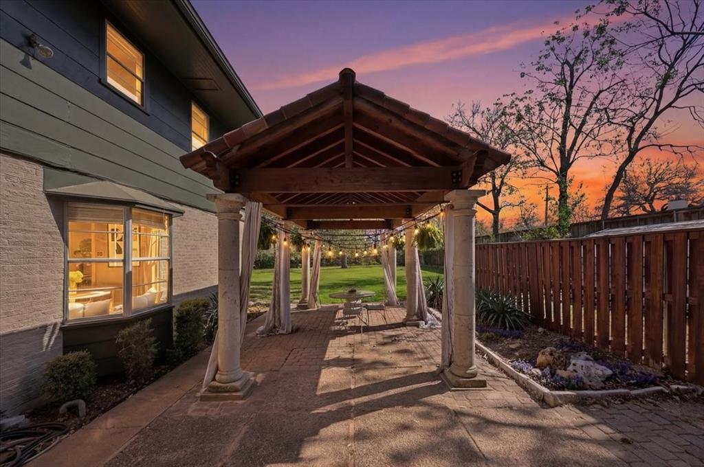 6321 Greenway Road Fort Worth, TX 76116 - Photo 3 of 40 Patio terrace at dusk with a patio and a fenced backyard