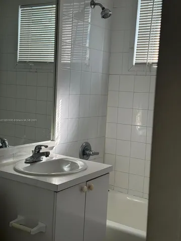 a bathroom with a sink and a bathtub