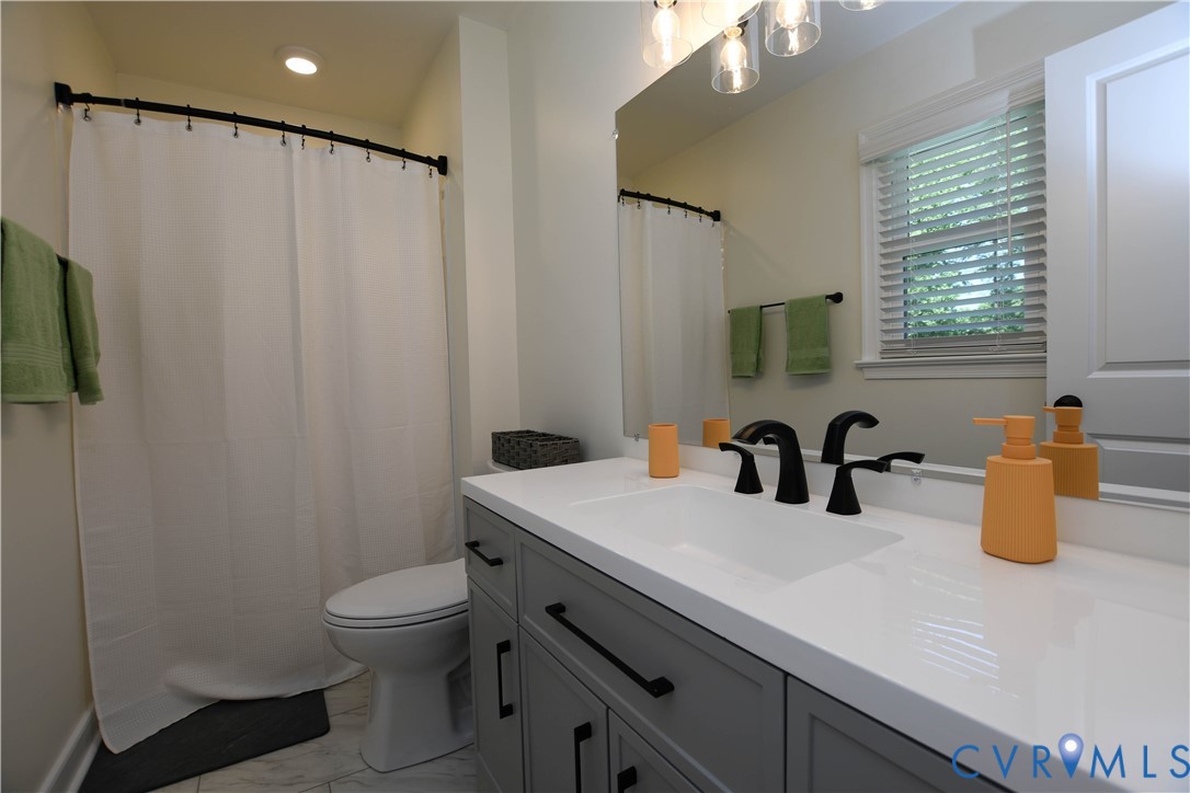 1448 Canterbury Road St. Stephens Church, VA 23148 - Photo 26 of 57 Bathroom featuring a white vanity with integrated