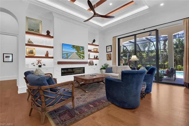 a kitchen with granite countertop a sink and a white wooden cabinets