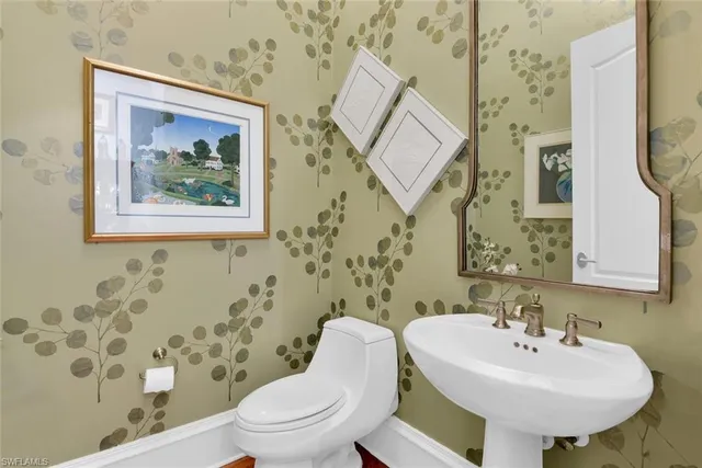 a view of a workspace with furniture and a potted plant