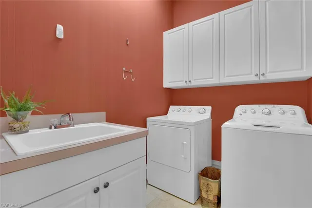 a bathroom with a sink vanity mirror and toilet