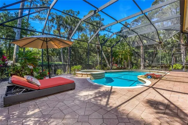 a view of a swimming pool with a patio