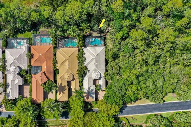 a swimming pool with outdoor seating and yard