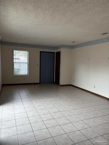 a view of an empty room and windows