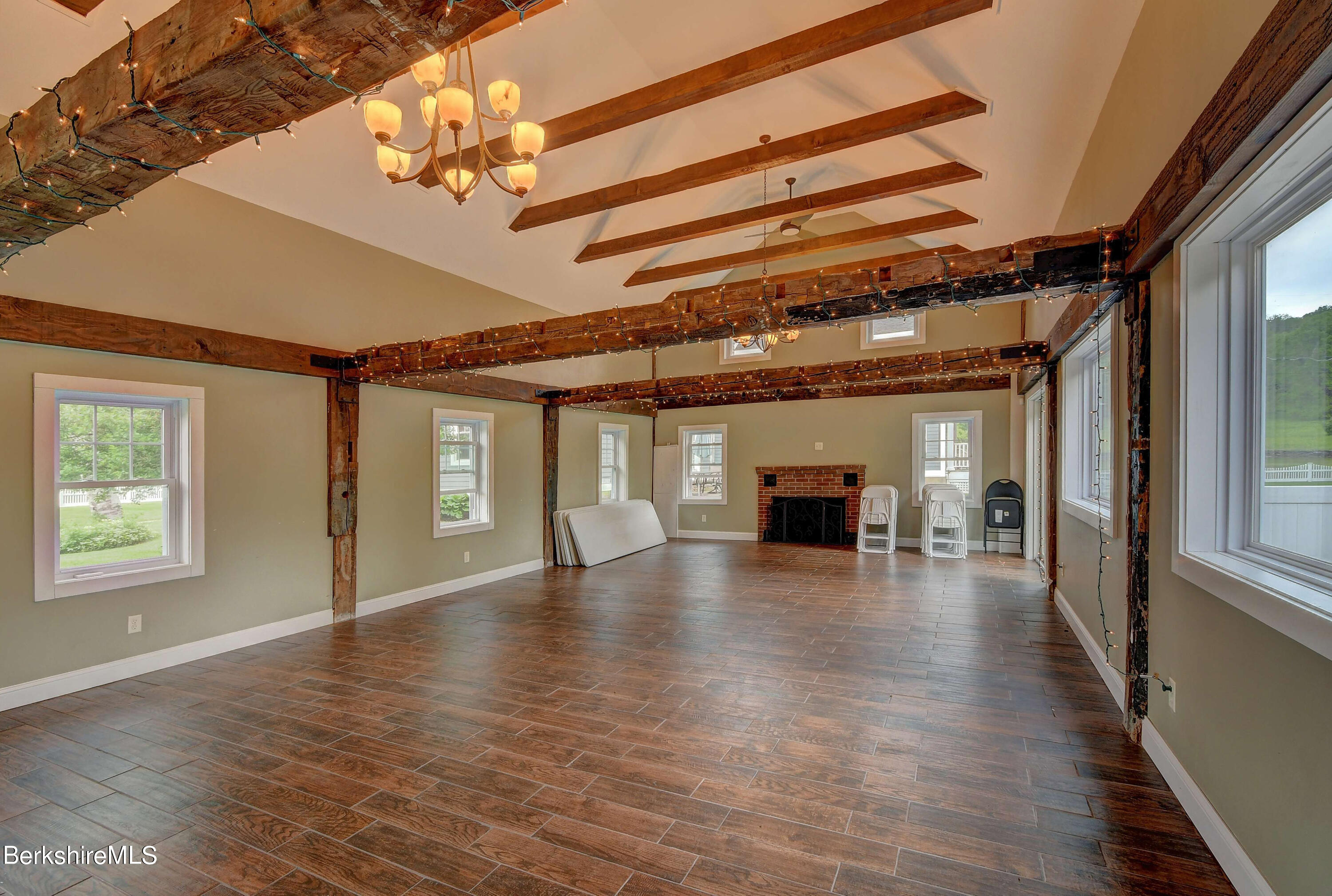 1 Devon Road Stockbridge, MA 01262 - Photo 55 of 58 a view of empty room with wooden floor and fireplace