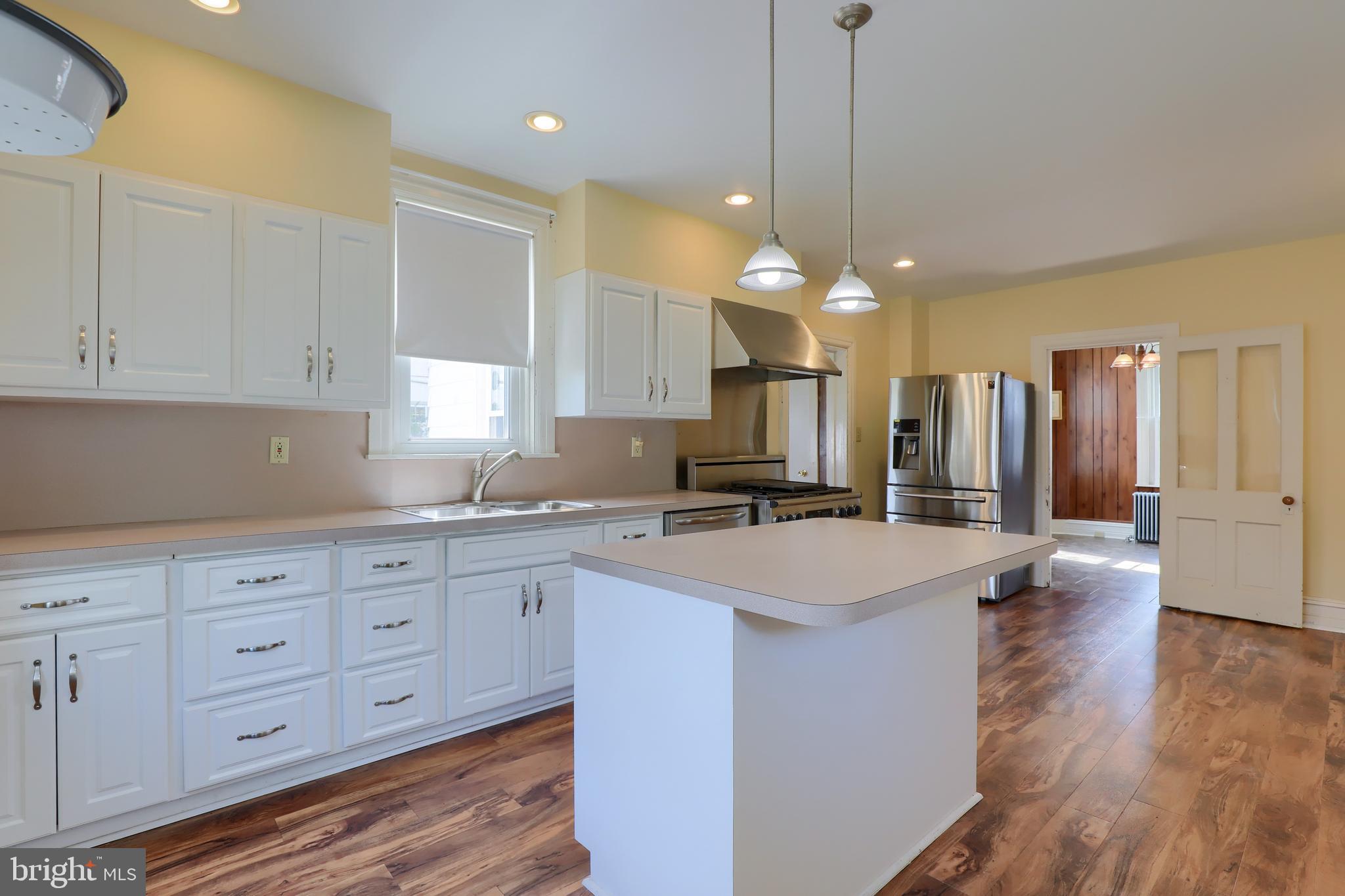 1141 Letort Road Conestoga, PA 17516 - Photo 11 of 49 a kitchen with wooden cabinets and white appliances