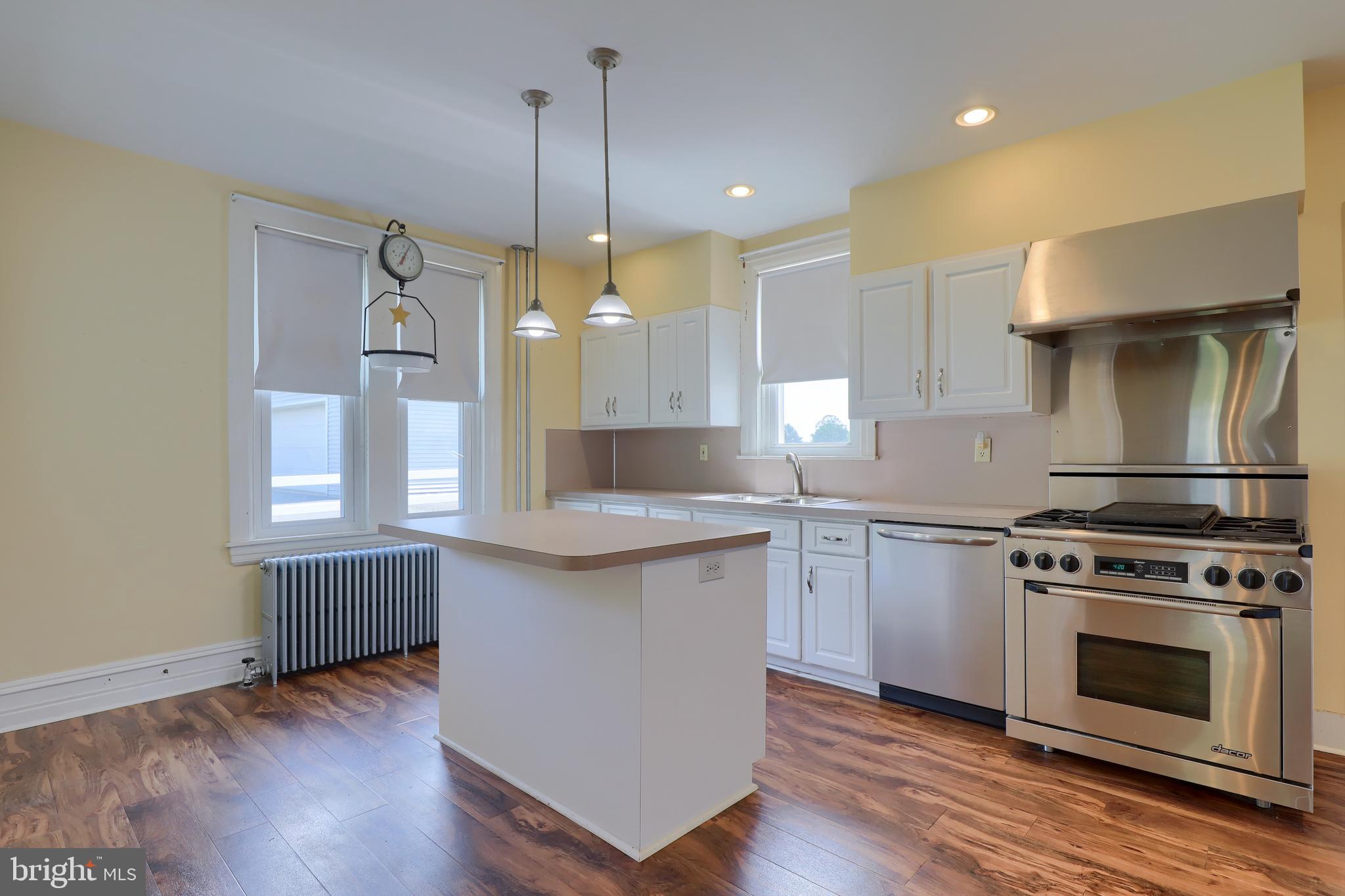 1141 Letort Road Conestoga, PA 17516 - Photo 12 of 49 a kitchen with a stove a sink and wooden floor