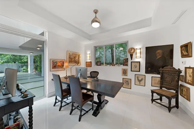 a view of a house with a tree in front