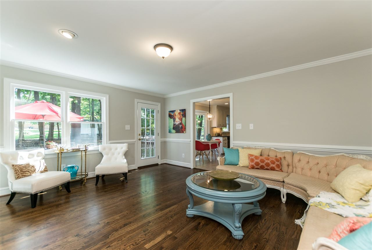 4908 Fielding Drive Raleigh, NC 27606 - Photo 5 of 25 This home has beautifully refinished hardwoods done in a rich walnut satin finish. The view out of the family room windows and onto the backyard is mesmerizing! Watch the birds & squirrels during the day and fireflies light up the night! Family Room