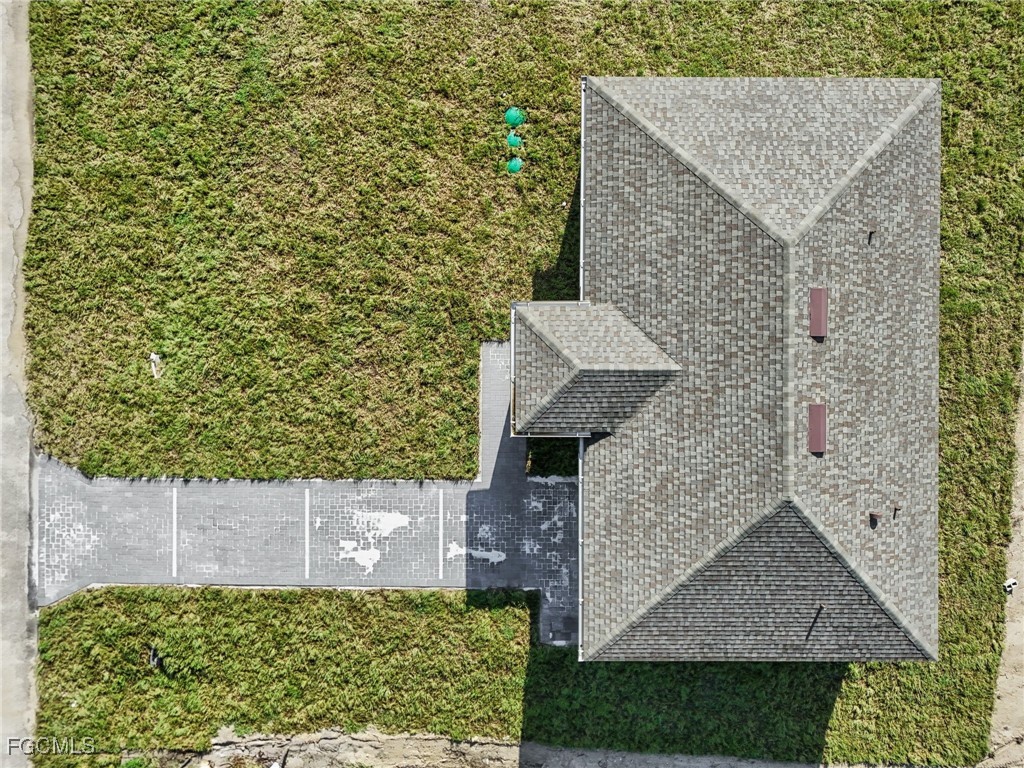 4402 East 19th Street Lehigh Acres, FL 33972 - Photo 12 of 31 front view of a house with a yard