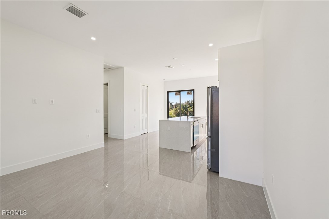 4402 East 19th Street Lehigh Acres, FL 33972 - Photo 18 of 31 a view of a room with cabinet and a kitchen
