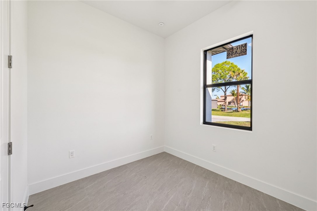 4402 East 19th Street Lehigh Acres, FL 33972 - Photo 21 of 31 an empty room with a window
