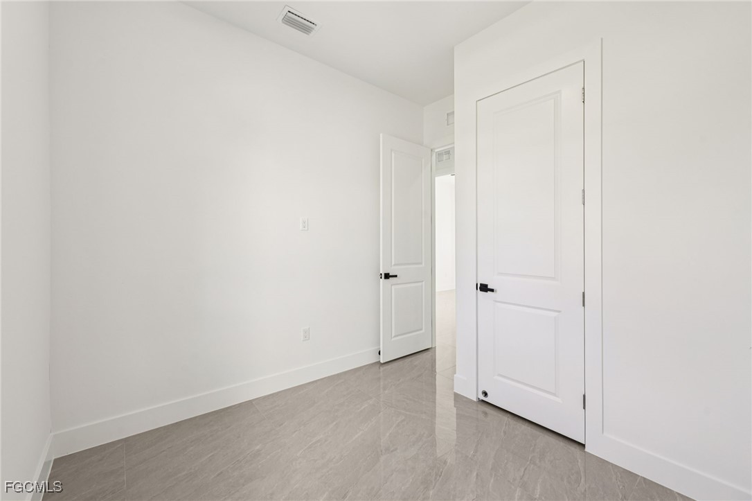 4402 East 19th Street Lehigh Acres, FL 33972 - Photo 22 of 31 a view of an empty room
