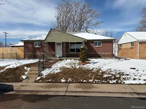 a front view of house with yard outdoor seating and garage