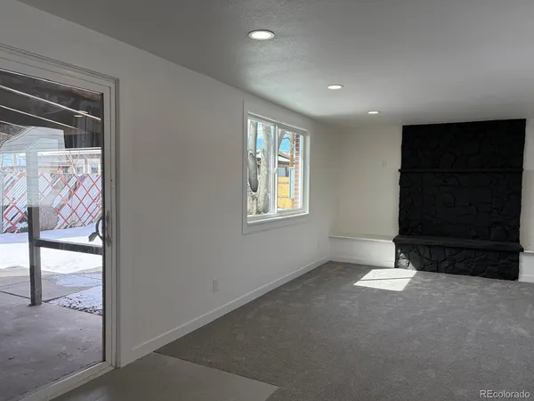 a view of an empty room with a window