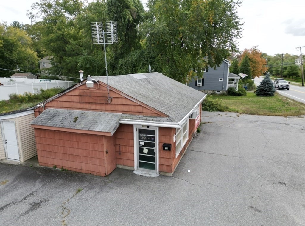30 Boston Road Billerica, MA 01862 - Photo 3 of 8 a view of a wooden house with a yard