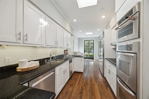 a view of a room with furniture window and wooden floor