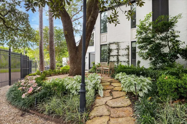 a view of a backyard with large trees