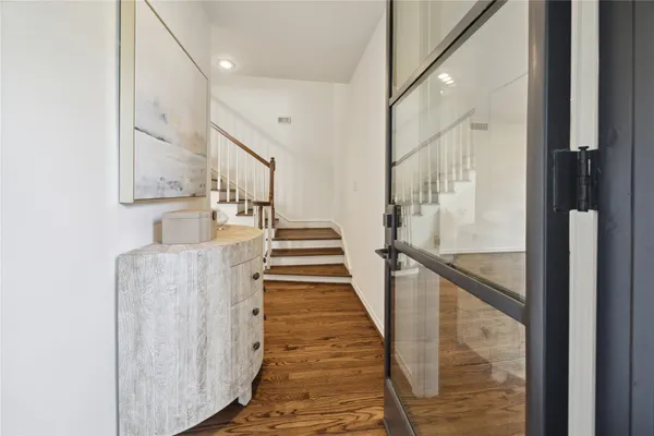 a view of a hallway with staircase